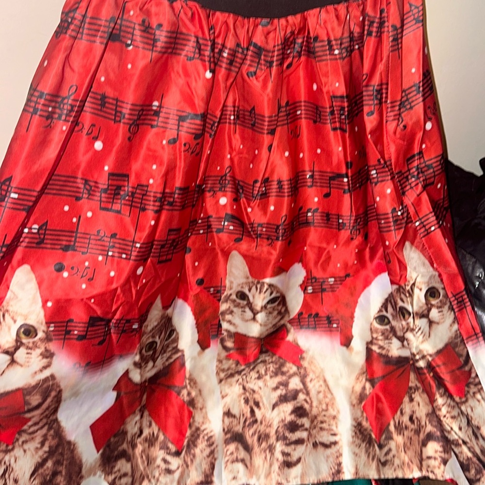 Red and black Christmas dress with cats and musical notes